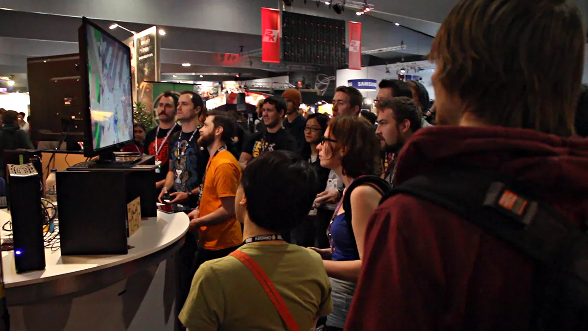 Crowd gathered around a Swordy demo station at PAX.